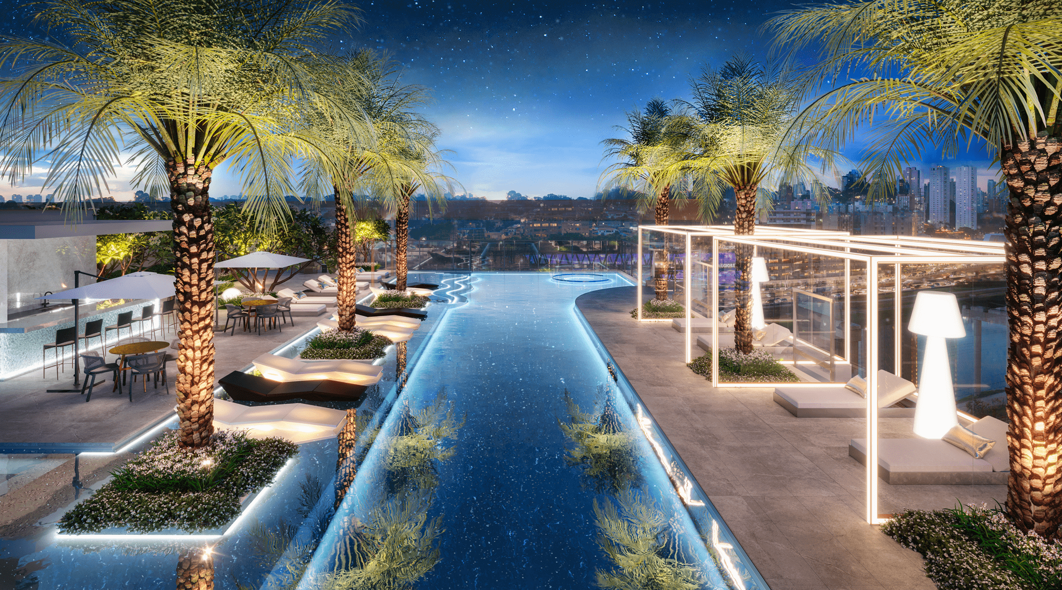 Piscina externa iluminada com palmeiras, espreguiçadeiras e área de bar, com vista para a cidade à noite sob um céu estrelado.
